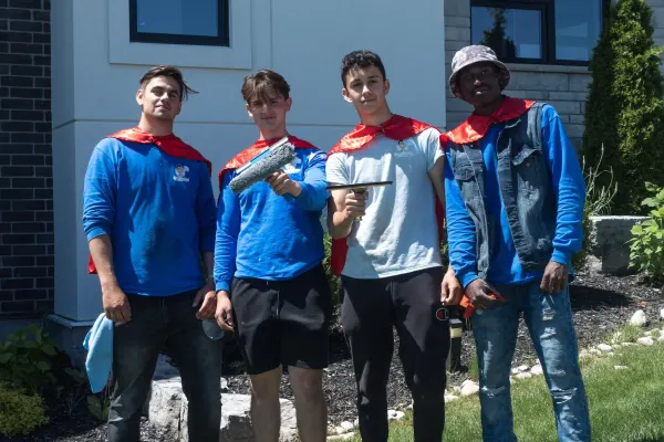 Four Hero Washing crew members with their cleaning gear