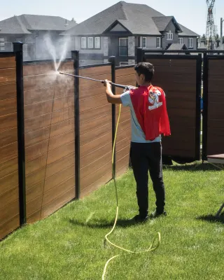 Pressure washing a wooden fence in Kitchener-Waterloo